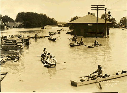 People get around in boats at the railroad station in Cary