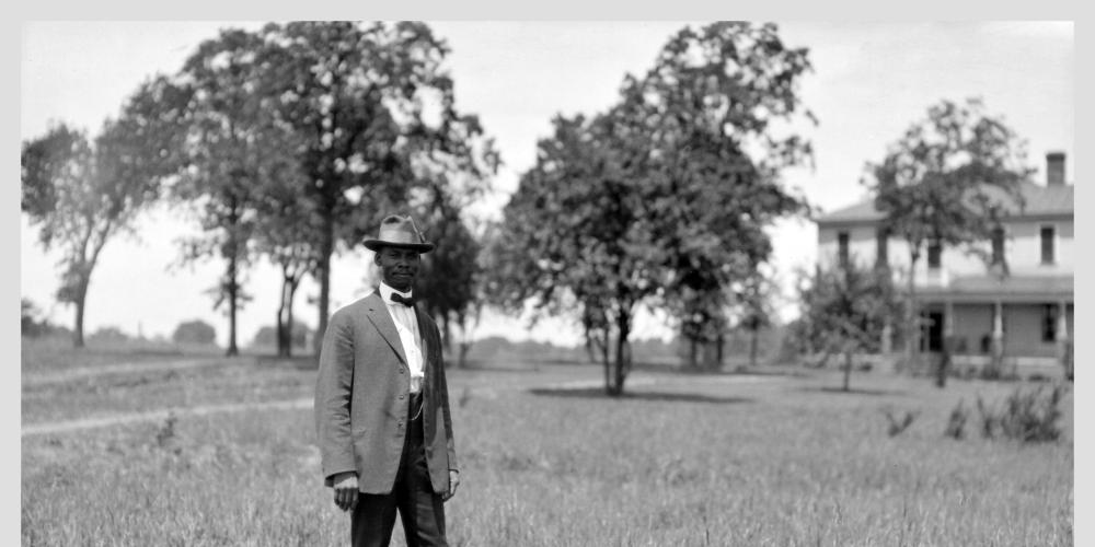 Wallace Battle in front of the president’s home on the Okolona Campus in 1916.